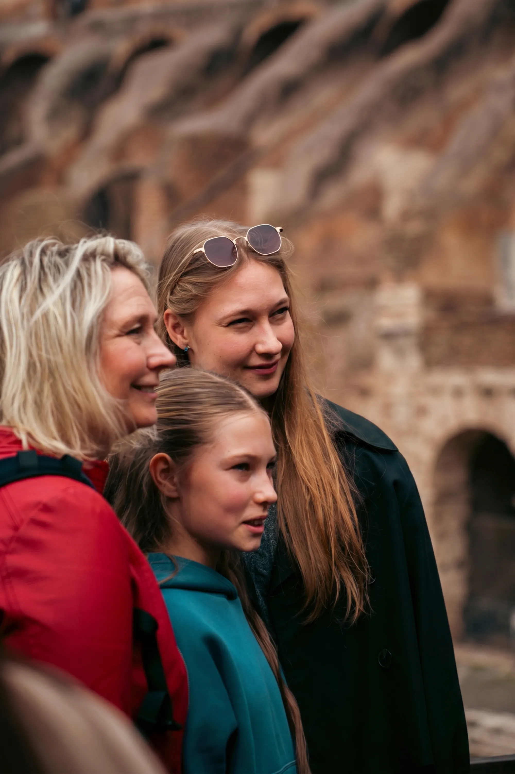 Multigenerational family group travel at the Colosseum in Rome